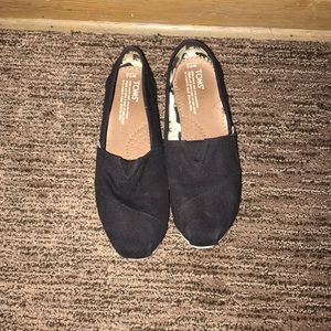 Toms black slip ons
